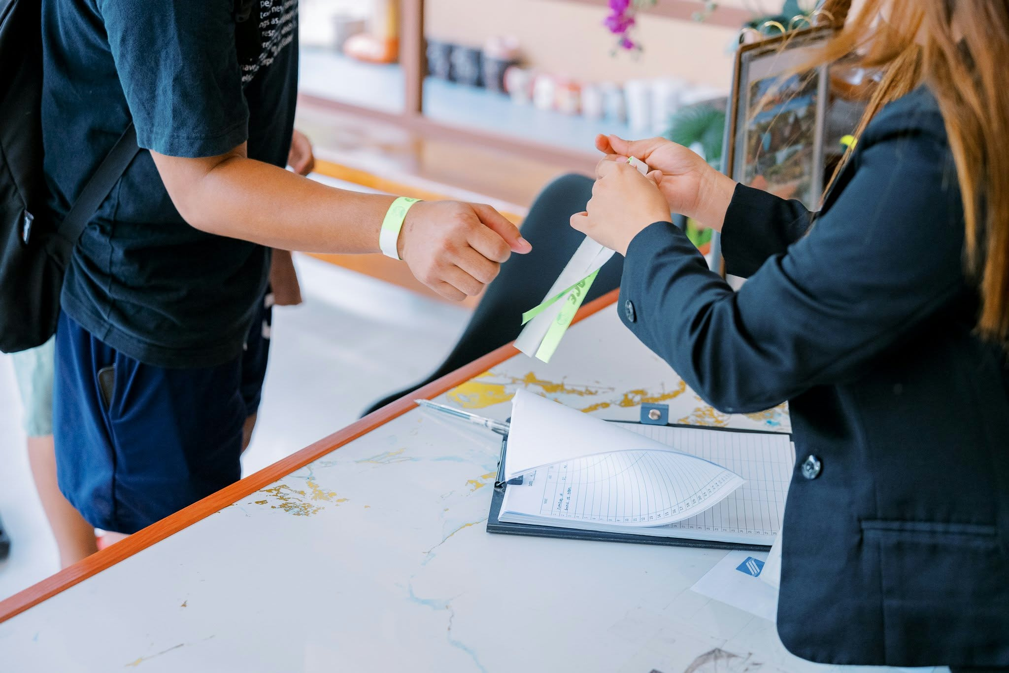 Wristband check-in at the front desk