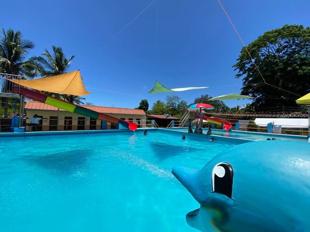 Kiddie pool with dolphin statue